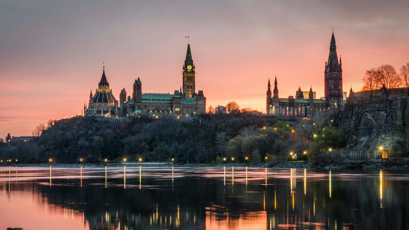 Twilight view of the Ottawa skyline reflecting on the calm waters, highlighting the robust Ottawa Housing Market